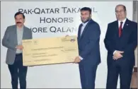  ??  ?? Pak-Qatar Family Takaful CEO Azeem Iqbal Pirani presents a gift of PKR 10 million Individual Family Takaful coverage to Lahore Qalandars’ owner Fawad Naeem Rana, as head of Individual Life, Agency and Marketing Muhammad Waqas Durrani looks on, at a special ceremony in Karachi recently.
