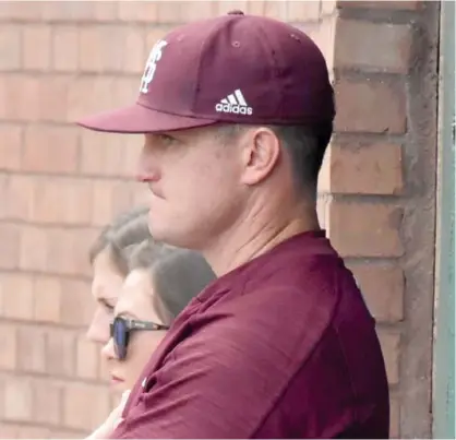  ?? (Photo by Jason Cleveland, SDN) ?? Andy Cannizaro stands in the dugout during a game last season for Mississipp­i State.