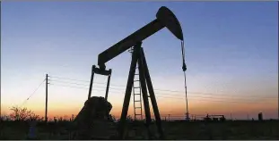  ?? JACOB FORD / ODESSA (TEXAS) AMERICAN ?? A pump jack operates in an oil field in the Permian Basin in Texas earlier this year. OPEC is meeting today to decide whether to further cut production to boost prices.
