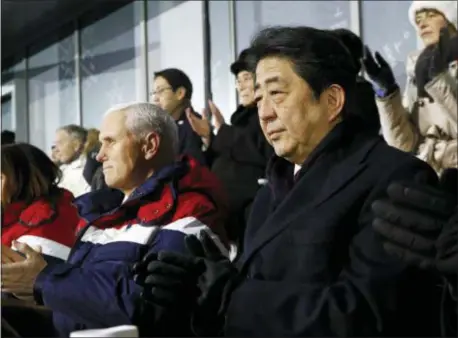 ?? PATRICK SEMANSKY, POOL - THE ASSOCIATED PRESS ?? Japanese Prime Minister Shinzo Abe, right, sits alongside Vice President Mike Pence, center, and second lady Karen Pence at the opening ceremony of the 2018 Winter Olympics in Pyeongchan­g, South Korea, Feb. 9. Pence was all set to hold a history-making...