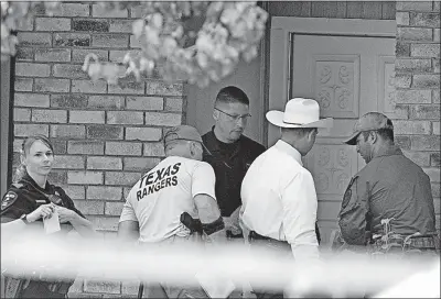  ?? [DAVID WOO/THE DALLAS MORNING NEWS] ?? Plano, Texas, police and Texas Rangers work the scene of a shooting at a home in the 1700 block of West Spring Creek Parkway in the Dallas suburb on Monday.