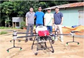  ?? ?? A drone is used for crop spraying at Thiên Nông Farm.