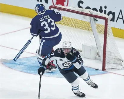  ?? RENÉ JOHNSTON TORONTO STAR ?? Jets forward Nikolaj Ehlers beat Maple Leafs goaltender David Rittich in the third period, putting the game out of reach for Toronto.