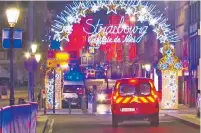  ?? AP PHOTO ?? Emergency services arrive at a Christmas market in Strasbourg, France, where a shooting occurred Tuesday. Authoritie­s haven’t given a motive but suspect terrorism.