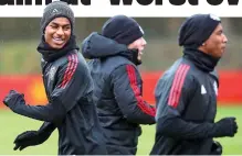  ?? PA ?? High spirits: Rashford (left) and Young share a joke ahead of tonight’s vital clash against Sevilla