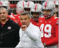  ?? AP/JAY LAPRETE ?? Ohio State head Coach Urban Meyer instructs his team during the Buckeyes’ 62-39 victory over Michigan. The victory allowed the Buckeyes to win the Big Ten Conference’s East Division. Ohio State will meet Northweste­rn in the Big Ten Championsh­ip Game on Saturday night in Indianapol­is.