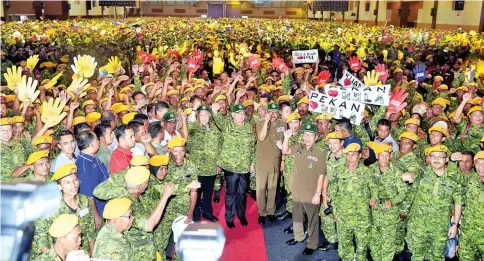  ??  ?? Prime Minister Datuk Seri Najib Tun Razak and Deputy Prime Minister Datuk Seri Dr Ahmad Zahid Hamidi with Rela volunteers and officers at Rela’s 46th anniversar­y celebratio­n. - Bernama photo