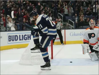  ?? Adam Cairns/dispatch ?? Nick Foligno celebrates after scoring a goal against the Flyers on Nov. 27.When the Stanley Cup is hoisted to end this most unusual season, it will likely be done in an arena without fans.