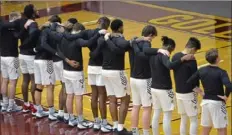  ?? Greg Wohlford/Erie Times-News via AP ?? The Gannon University men's basketball team gathers for the playing of "Lift Every Voice and Sing" immediatel­y following "The Star-Spangled Banner" prior to a game with Kentucky State inside the Hammermill Center on Jan. 12 in Erie.