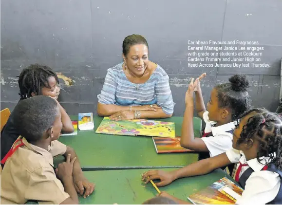  ?? ?? Caribbean Flavours and Fragrances General Manager Janice Lee engages with grade one students at Cockburn Gardens Primary and Junior High on Read Across Jamaica Day last Thursday.