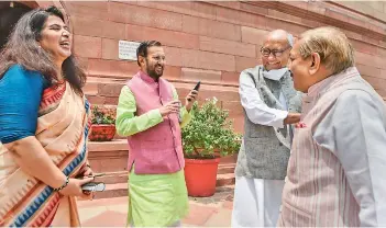  ?? — PTI ?? Rajya Sabha MPS Saroj Pandey and Prakash Javadekar of BJP and Digvijay Singh and Pramod Tiwari of Congress at Parliament House during ongoing Monsoon Session in New Delhi on Tuesday.