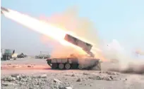 ?? Florian Neuhof for The National ?? A rocket launcher in the village of Adbah fires on ISIL militants at Mosul airport yesterday.