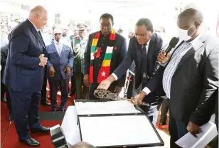  ?? ?? The Belarusian leader prepares to hand over a symbolic key to President Mnangagwa during the official launch of Phase 2 of the Belarus Mechanisat­ion Facility at the Institute of Agricultur­al Engineerin­g in Pomona, Harare, yesterday. (More Pictures on Page 3)