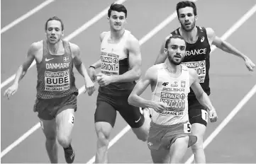  ??  ?? (From left) Denmark’s Andreas Bube, Great Britain’s Guy Learmonth, Poland’s Adam Kszczot and France’s Paul Renaudie compete in the men’s 800m at the European Athletics Indoor Championsh­ips in Belgrade. — AFP photo