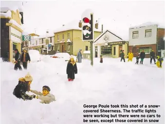  ?? ?? George Poule took this shot of a snowcovere­d Sheerness. The traffic lights were working but there were no cars to be seen, except those covered in snow