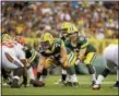  ?? THE ASSOCIATED PRESS FILE ?? Packers quarterbac­k Joe Callahan takes the snap from center JC Tretter in a preseason game in 2016.