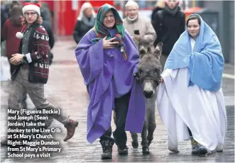  ??  ?? Mary (Figueira Beckie) and Joseph (Sean Jordan) take the donkey to the Live Crib at St Mary’s Church. Right: Maggie Dundon from St Mary’s Primary School pays a visit