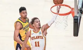  ?? DALE ZANINE/USA TODAY SPORTS ?? Hawks guard Trae Young scored 34 points in a win over the Pacers on Sunday.