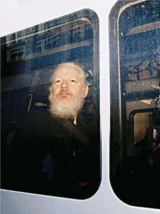  ??  ?? Julian Assange in London, April 11, 2019. © Henry Nicholls / Reuters