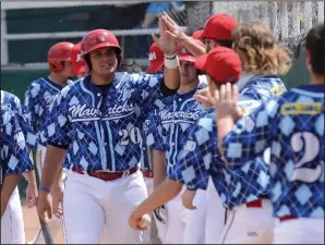  ?? NEWS PHOTO RYAN MCCRACKEN ?? Medicine Hat Mavericks first baseman Sal Rodriguez celebrates with his teammates after scoring a run in Sunday’s Western Major Baseball League matchup against the Fort McMurray Giants at Athletic Park. The Mavs were sporting special uniforms for their...