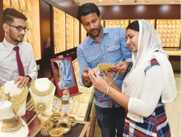  ?? Virendra Saklani/Gulf News ?? Customers at Deira Gold Souq. Gold demand fell to 6 tonnes, a 13 per cent decline from thirdquart­er 2017, says the World Gold Council, with some retailers ‘registerin­g losses for the first time’.