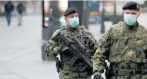  ?? Photo / AP ?? Serbian soldiers patrol in Belgrade's main pedestrian street.