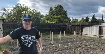  ?? COURTESY OF LINDSAY WALDROP ?? Lindsay Waldrop stands near her garden at her home in Anaheim, Calif. Waldrop plowed 1,000square feet of grass to start a garden this year. She has planted dozens of tomatoes, eggplants and peppers with many more crops started as seeds.