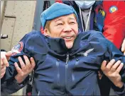  ?? ?? Yusaku Maezawa is assisted as he disembarks from a helicopter at airport, in Zhezkazgan, Kazakhstan, on Monday.