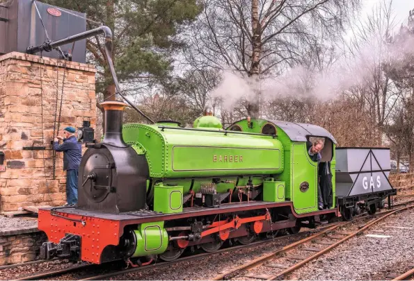  ?? ALAMY ?? ABOVE Barber takes water at Alston, headquarte­rs of the South Tynedale Railway. The attached vehicle, which is loosely modelled on the Harrogate bogie hopper wagons, acts as a tender, giving Barber greater range.