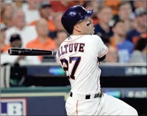  ?? David J. Phillip / The Associated Press ?? Houston’s Jose Altuve hits a solo home run during Thursday’s game against Boston.