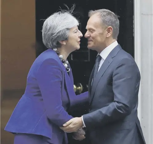  ??  ?? 0 Theresa May met the European Council president in Downing Street, with Donald Tusk criticisin­g the UK government’s red lines