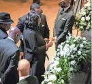  ?? ANDREW NELLES/THE TENNESSEAN VIA AP/POOL ?? RowVaughn Wells stops in front of the casket of her son, Tyre Nichols, at his funeral service in Memphis, Tenn., on Wednesday. Nichols died Jan. 10 after being beaten by police on Jan. 7.