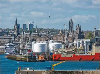  ??  ?? Ships sailing into Aberdeen’s busy harbour