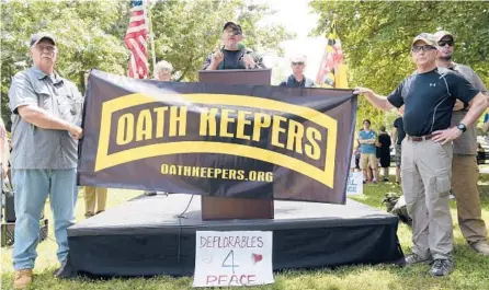  ?? SUSAN WALSH/AP 2017 ?? Oath Keepers founder Stewart Rhodes, center, was indicted by federal prosecutor­s last week on a charge of seditious conspiracy.