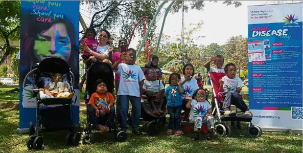  ??  ?? Patients with rare lysosomal storage diseases posing for a photo at Taman Jaya Park, Petaling Jaya, Selangor, in conjunctio­n with this year’s World Rare Disease Day celebratio­ns. Only eight out of the over 50 types of this disease can be treated, but...