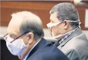  ?? JOE BURBANK/ ORLANDO SENTINEL ?? Defense counsel sits with accused killer Angel Luis Rivera, right, the fatherin-law of victim Nicole Montalvo, in Osceola Circuit Court in Kissimmee on Tuesday.