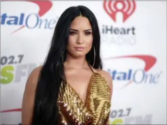  ?? PHOTO BY RICHARD SHOTWELL — INVISION — AP, FILE ?? Demi Lovato arrives at Jingle Ball at The Forum in Inglewood. Lovato celebrated six years sober at a concert in New York with tour mate and DJ Khaled, whose powerful brought the pop star to tears. Lovato performed Friday at the Barclays Center in...