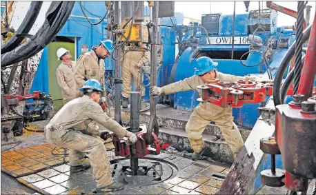  ?? [OKLAHOMAN ARCHIVES] ?? A crew operates a rig drilling a SandRidge well near Medford in 2012. While the company continues to drill some Mississipp­ian Lime assets, it also is working on developing acreage it holds in Oklahoma's STACK play and in Colorado's Niobrara Shale.
