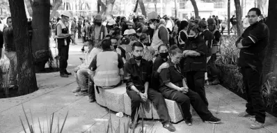  ?? AP ?? Employees gather outside of their work building after a 7.5 earthquake in Mexico City yesterday.