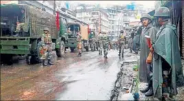  ?? PTI PHOTO ?? Army personnel stand guard in Darjeeling town on Sunday before the funeral procession of three men who were allegedly killed in the police firing on Saturday.