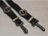  ??  ?? Above: The Second Model RLB dagger exhibited an enameled swastika in the grip after 1938. The leather hangers matched the leather on the scabbard and grip (warrelics.com).
Above right: The leather hangers for the TeNo Leader dagger (Militaryco­llectibles­inc.com)