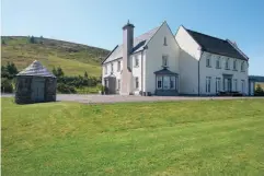  ??  ?? Main image: The drawing room is spacious but feels cosy. Above right: The exterior bathed in sunshine.