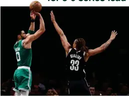  ?? AL BELLO/GETTY IMAGES ?? Jayson Tatum (L) of the Celtics shoots during a victory over the Nets in Game 3 of the first-round NBA playoff series at Barclays Center, Brooklyn, NY, US, on April 23, 2022.