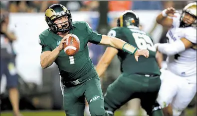  ?? AP/DAVID ZALUBOWSKI ?? Colorado State quarterbac­k K.J. Carta-Samuels is averaging more than 356 passing yards per game, including a school-record 537 yards in the season opener against Hawaii, entering Saturday’s game against Arkansas.