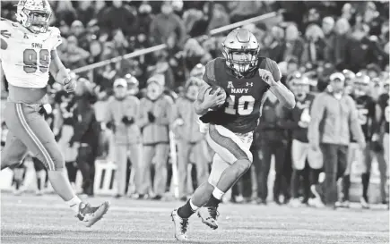  ??  ?? Navy slotback Malcolm Perry has 11 TDs, including two receiving and one throwing. TOMMY GILLIGAN/USA TODAY SPORTS