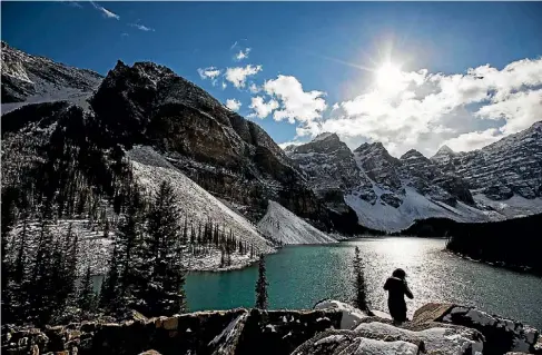  ?? REUTERS ?? Banff in the Canadian Rocky Mountains is home to idyllic lakes and landscapes, popular year-round.