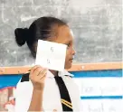  ??  ?? It’s mathematic­s and it’s fun – a student of Port Antonio Primary School, Portland.