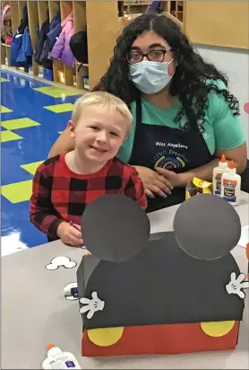  ?? SUBMITTED ?? Lorain County JVS Early Childhood Education junior, Angellena Robles (Elyria) works with preschoole­r Jack Olsen (Norwalk), on his shoebox for Head Start.