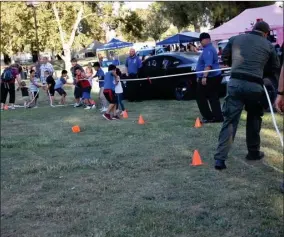  ?? RECORDER PHOTO BY JAMIE A. HUNT ?? A Tug-of-war was hosted by Portervill­e PD.