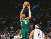  ?? CRAIG MITCHELLDY­ER/AP ?? No surprise, two-time NBA MVP Giannis Antetokoun­mpo and the Bucks are in a tight Eastern Conference race with the first-place Celtics.